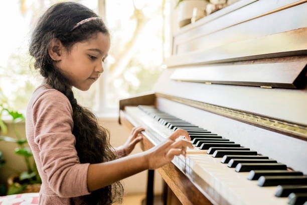 cute-girl-playing-piano-at-home